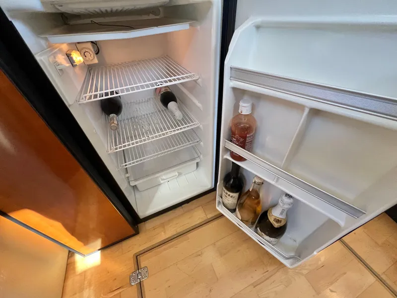 Slide: The Image of Open fridge in 2004 Carver 420 Mariner yacht, stocked with beverages. - 22
