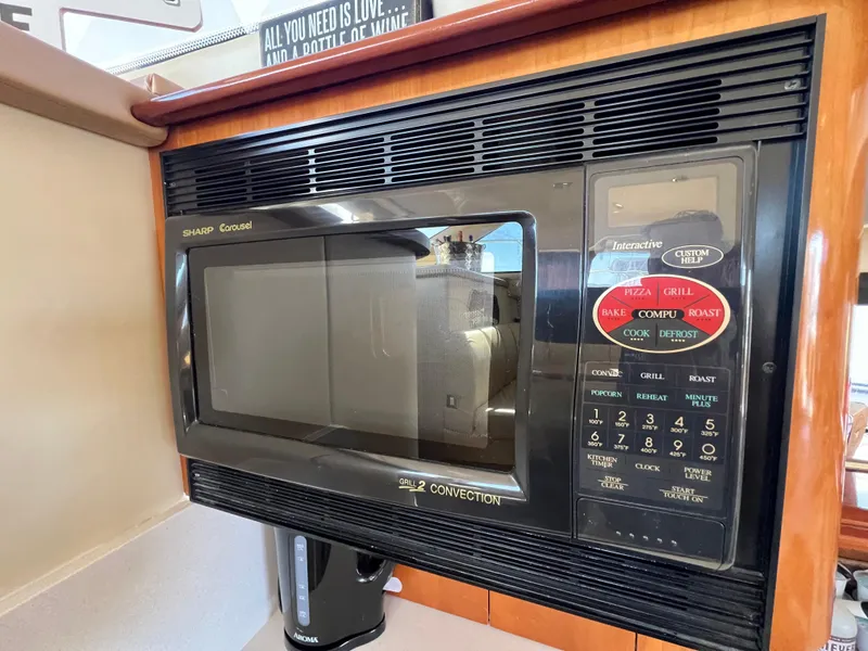 Slide: The Image of Sharp Carousel microwave in 2004 Carver 420 Mariner yacht kitchen. - 24