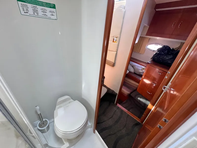 Slide: The Image of 2004 Carver 420 Mariner yacht interior with bathroom and cabin view. - 33