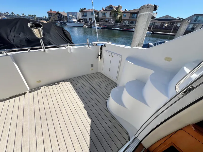 Slide: The Image of 2004 Carver 420 Mariner yacht deck with stairs, docked in a marina. - 11