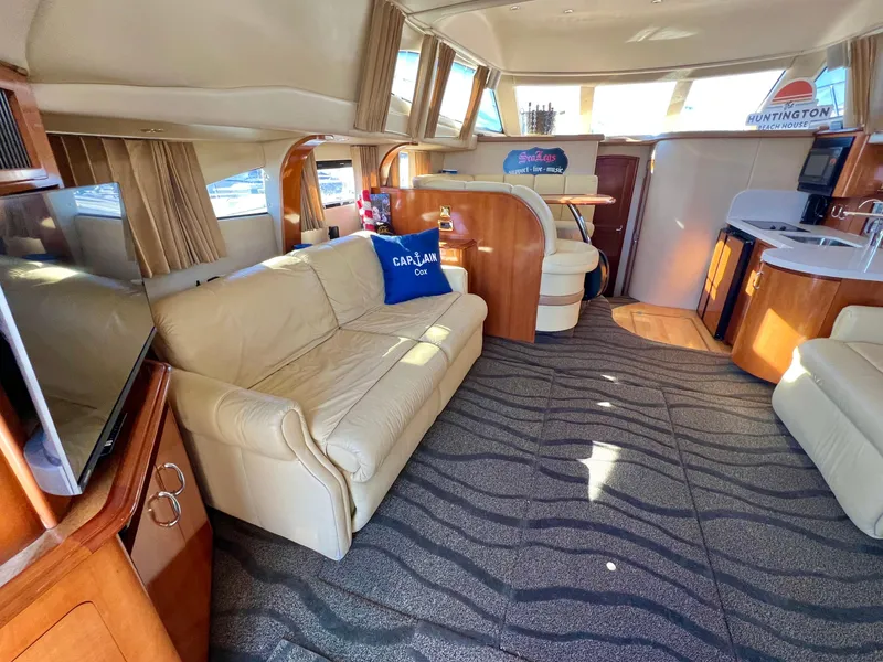 Slide: The Image of Luxurious interior of 2004 Carver 420 Mariner yacht with plush seating and modern amenities. - 13