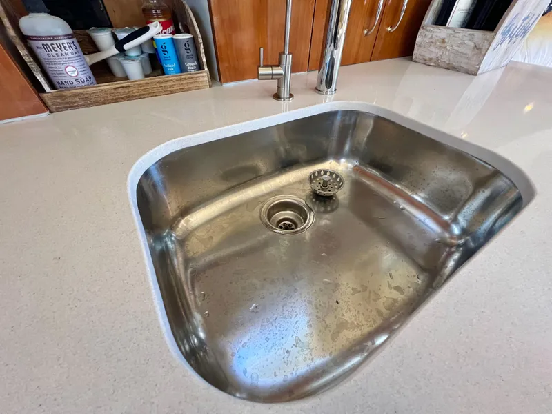 Slide: The Image of Stainless steel sink in 2004 Carver 420 Mariner yacht kitchen, with modern faucet and countertop. - 21