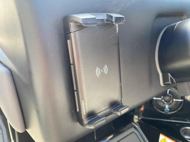 Slide: The Image of Wireless phone charger in 2025 ATX Surf Boats 24 Type-S dashboard. - 11