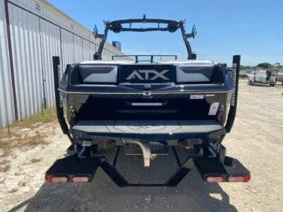 Slide: The Image of 2025 ATX Surf Boats 24 Type-S, rear view, parked outdoors. - 3