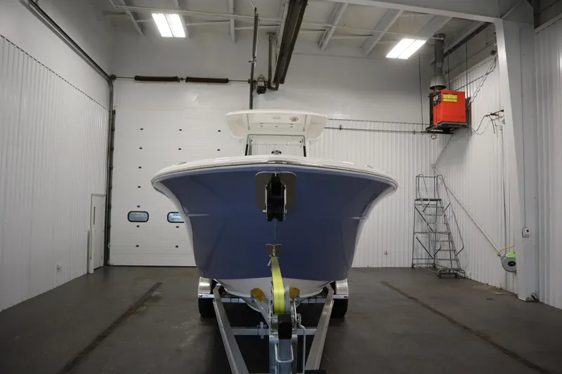 Slide: The Image of 2026 Sea Fox 268 Commander boat in a spacious indoor storage facility. - 1