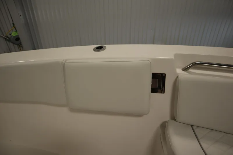 Slide: The Image of 2026 Sea Fox 268 Commander interior detail with white cushioned seating and metal handle. - 16