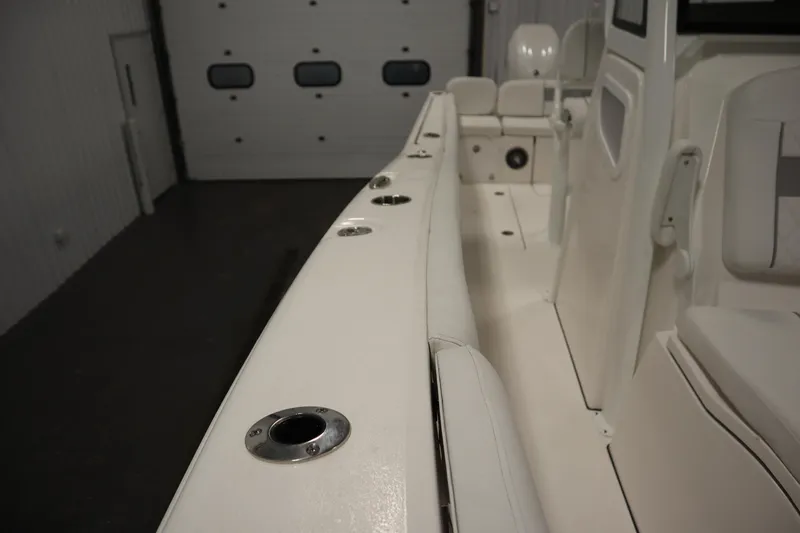Slide: The Image of 2026 Sea Fox 268 Commander boat interior with rod holders and seating. - 25