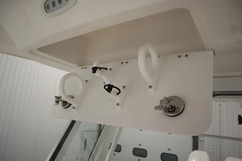 Slide: The Image of 2026 Sea Fox 268 Commander boat interior detail with rod holders and switches. - 27