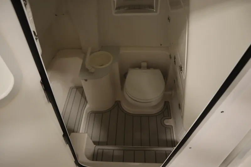 Slide: The Image of 2026 Sea Fox 268 Commander boat bathroom with toilet and sink. - 29