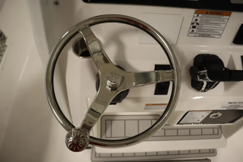 Slide: The Image of Steering wheel of 2026 Sea Fox 268 Commander boat, featuring sleek design and controls. - 37