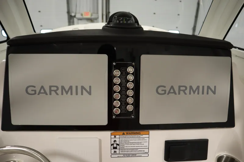 Slide: The Image of 2026 Sea Fox 268 Commander dashboard with dual Garmin displays and compass. - 39