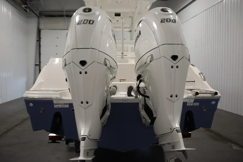 Slide: The Image of 2026 Sea Fox 268 Commander with dual 200 horsepower engines in a storage facility. - 5