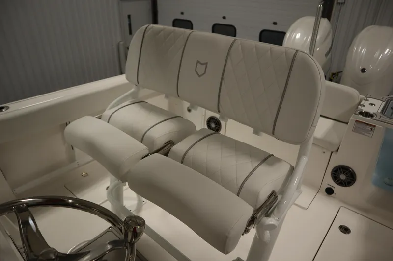 Slide: The Image of 2026 Sea Fox 268 Commander boat interior with luxurious white seating and steering wheel. - 50