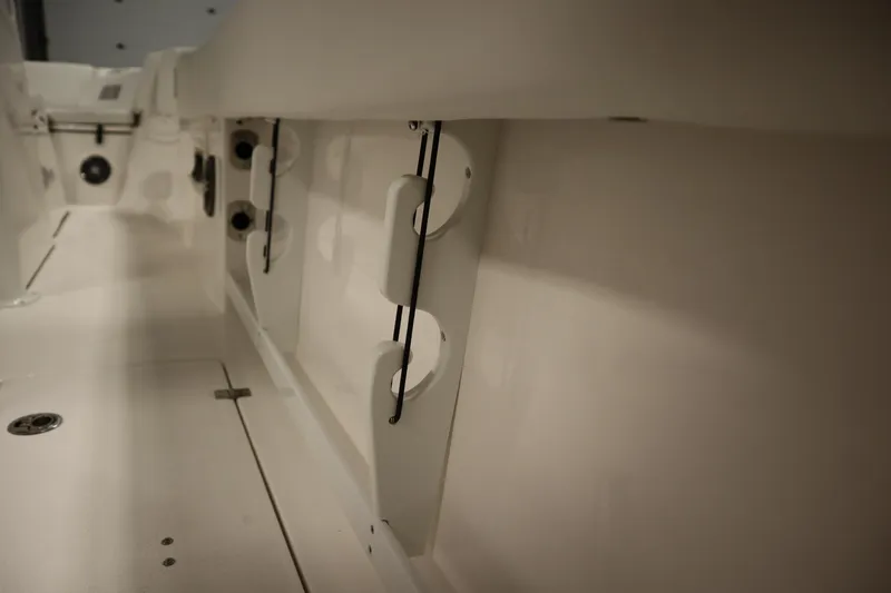 Slide: The Image of Interior view of 2026 Sea Fox 268 Commander boat, showcasing rod holders and storage. - 56