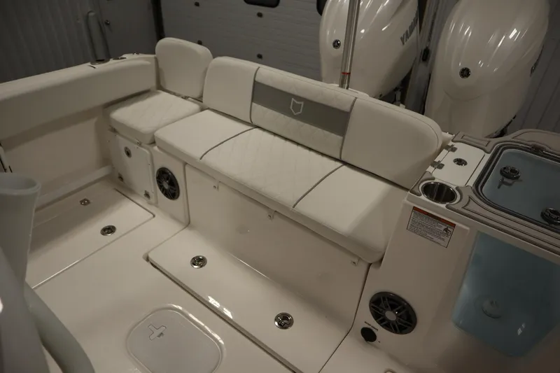 Slide: The Image of 2026 Sea Fox 268 Commander boat interior with cushioned seating and storage compartments. - 60