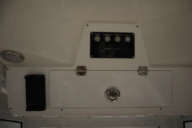 Slide: The Image of Control panel and storage compartment on 2026 Sea Fox 268 Commander boat. - 67