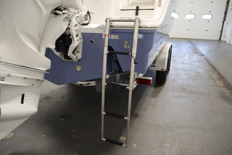 Slide: The Image of 2026 Sea Fox 268 Commander boat with ladder and trailer in a garage. - 72