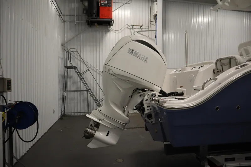 Slide: The Image of 2026 Sea Fox 268 Commander with Yamaha outboard in a garage setting. - 74