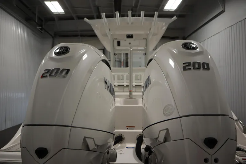 Slide: The Image of 2026 Sea Fox 268 Commander with dual Yamaha 200 engines in a garage setting. - 75