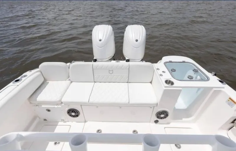 Slide: The Image of 2026 Sea Fox 268 Commander boat with dual engines and white seating on the water. - 93