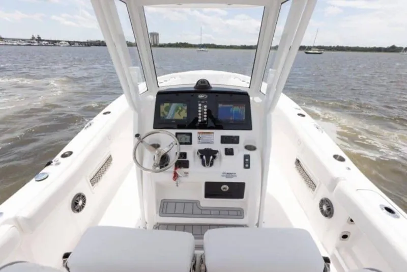 Slide: The Image of 2026 Sea Fox 268 Commander boat dashboard with steering wheel and navigation screens. - 98