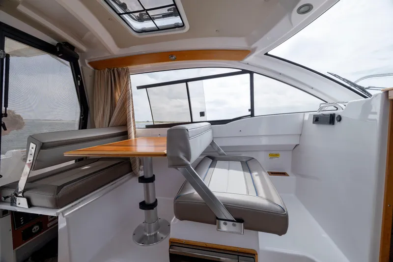 Slide: The Image of Interior of 2020 Cutwater C-24 boat with seating and table, featuring modern design. - 18