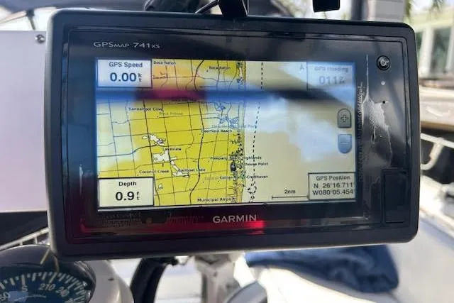 Slide: The Image of Steering wheel and speaker on 1987 Hunter 35 sailboat cockpit. - 13