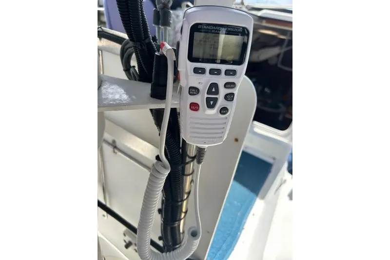 Slide: The Image of Cockpit of 1987 Hunter 35 sailboat with steering wheel and navigation equipment. - 17