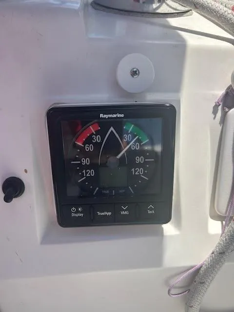 Slide: The Image of 1987 Hunter 35 sailboat cockpit with blue canopy and steering wheel. - 19