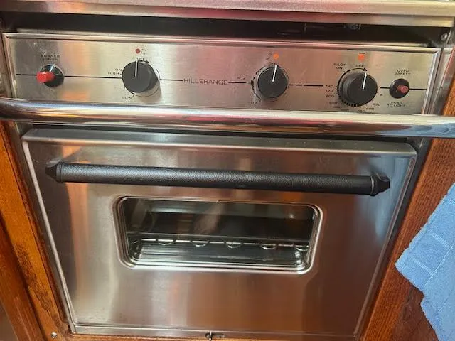 Slide: The Image of Stainless steel oven with control knobs, Hunter 35 model, 1987. - 29