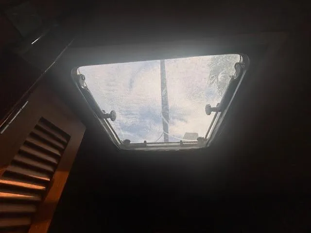 Slide: The Image of Interior view through a Hunter 35 sailboat hatch, showcasing a clear sky. - 31