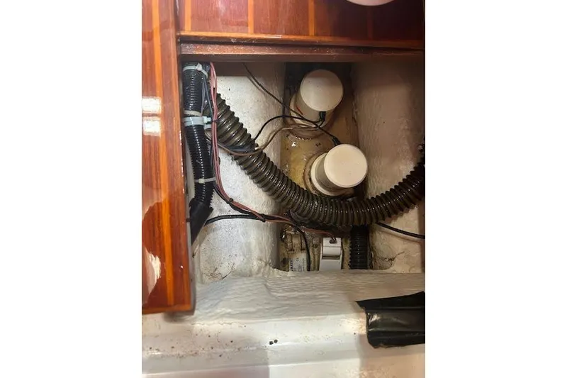 Slide: The Image of Interior view of 1987 Hunter 35 sailboat showing wiring and ventilation components. - 35