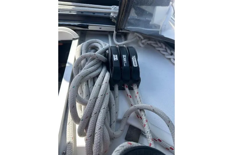 Slide: The Image of Rope clutches on a 1987 Hunter 35 sailboat deck, neatly organized. - 38