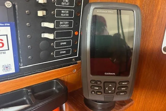 Slide: The Image of Garmin device on 1987 Hunter 35 yacht dashboard with control panel. - 45