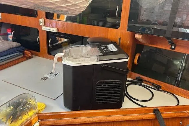 Slide: The Image of Compact ice maker on a 1987 Hunter 35 sailboat's wooden interior counter. - 46