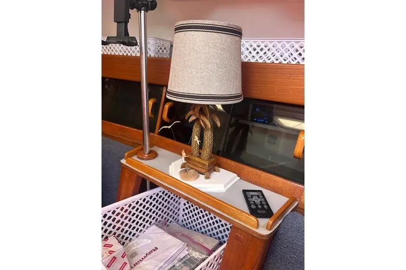 Slide: The Image of Decorative lamp on a 1987 Hunter 35 sailboat interior with wooden accents. - 49