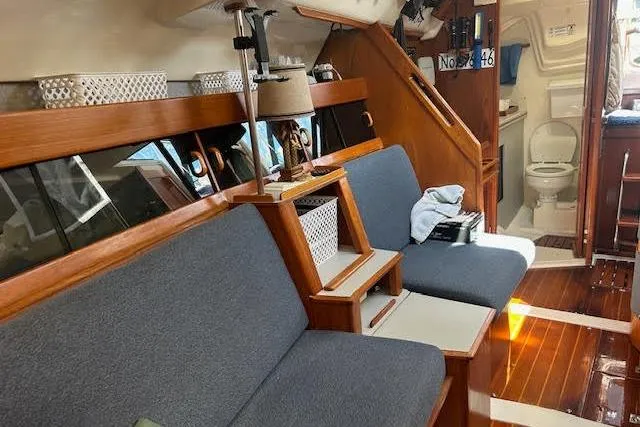 Slide: The Image of Interior of a 1987 Hunter 35 sailboat with wooden accents and cozy seating. - 54