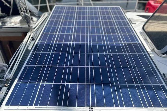 Slide: The Image of Solar panel on 1987 Hunter 35 sailboat deck, harnessing renewable energy. - 66