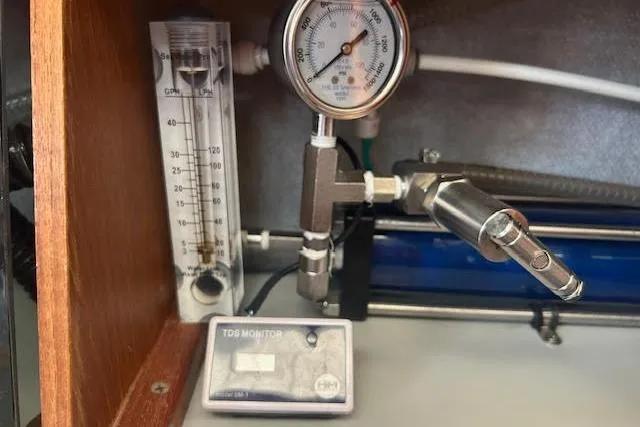 Slide: The Image of TDS monitor and pressure gauge setup on a 1987 Hunter 35. - 70