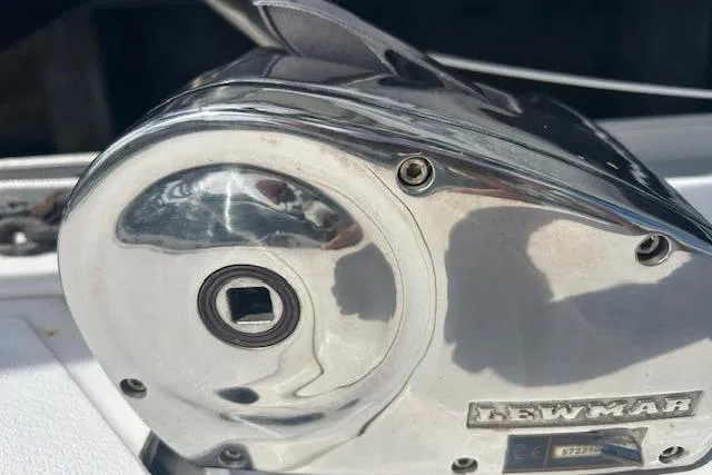 Slide: The Image of Chrome winch on 1987 Hunter 35 sailboat, featuring Lewmar branding. - 73