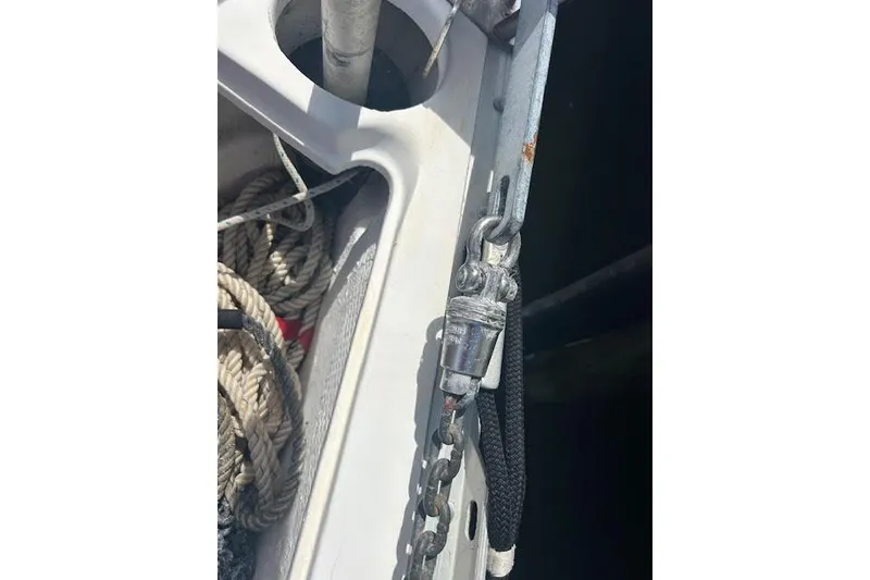 Slide: The Image of Close-up of a 1987 Hunter 35 sailboat deck with ropes and chain. - 76