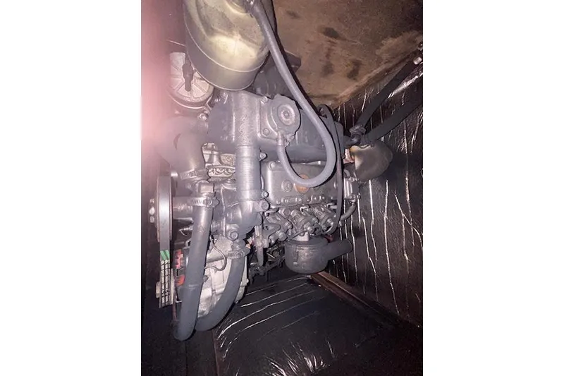 Slide: The Image of 1987 Hunter 35 engine compartment with visible components and wiring. - 81