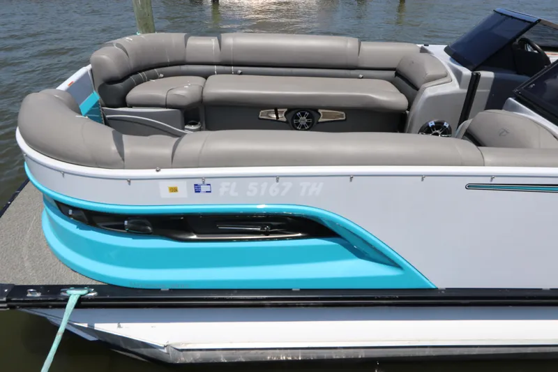 Slide: The Image of 2022 Tahoe Pontoon Grand Tahoe Twin Elite M2785 with gray seating and turquoise accents. - 8