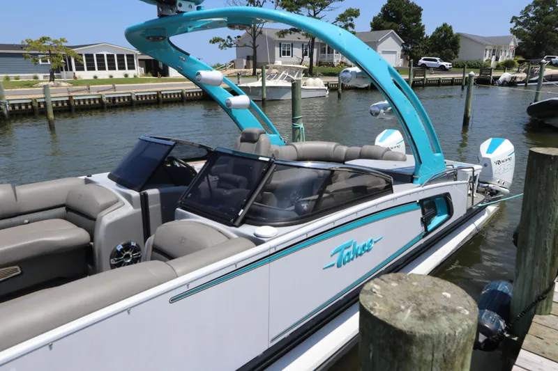 Slide: The Image of 2022 Tahoe Pontoon Grand Tahoe Twin Elite M2785 docked by waterfront homes. - 9
