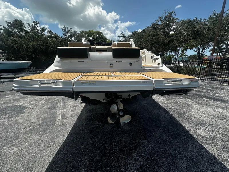 Slide: The Image of 2019 Sea Ray SDX 290 boat rear view with swim platform and propeller. - 3