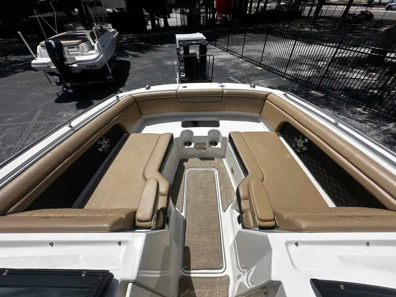 Slide: The Image of 2019 Sea Ray SDX 290 boat interior with tan seating and spacious layout. - 4