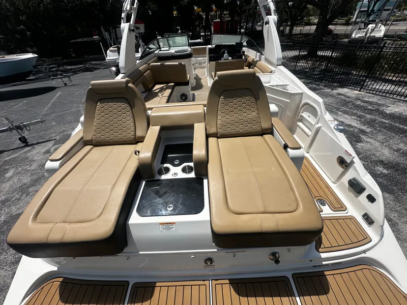 Slide: The Image of 2019 Sea Ray SDX 290 boat with tan leather seating and sleek design. - 8