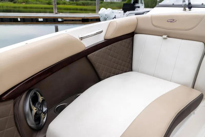 Slide: The Image of Luxurious seating on 2013 Regal 2700 ES Bowrider, featuring beige and white upholstery. - 14