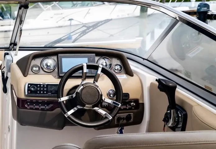 Slide: The Image of 2013 Regal 2700 ES Bowrider dashboard with steering wheel and control panel. - 9