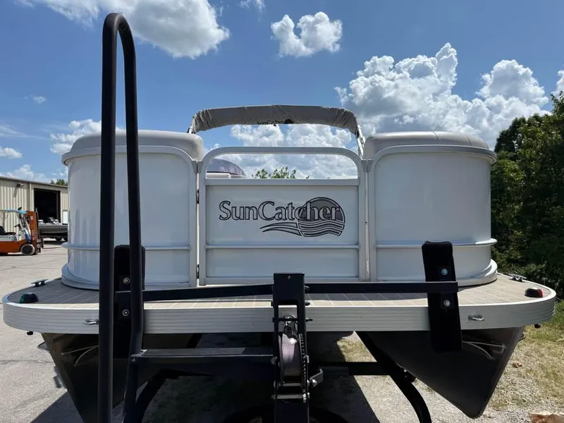 Slide: The Image of 2018 G3 V20C SunCatcher pontoon boat on trailer under blue sky. - 2